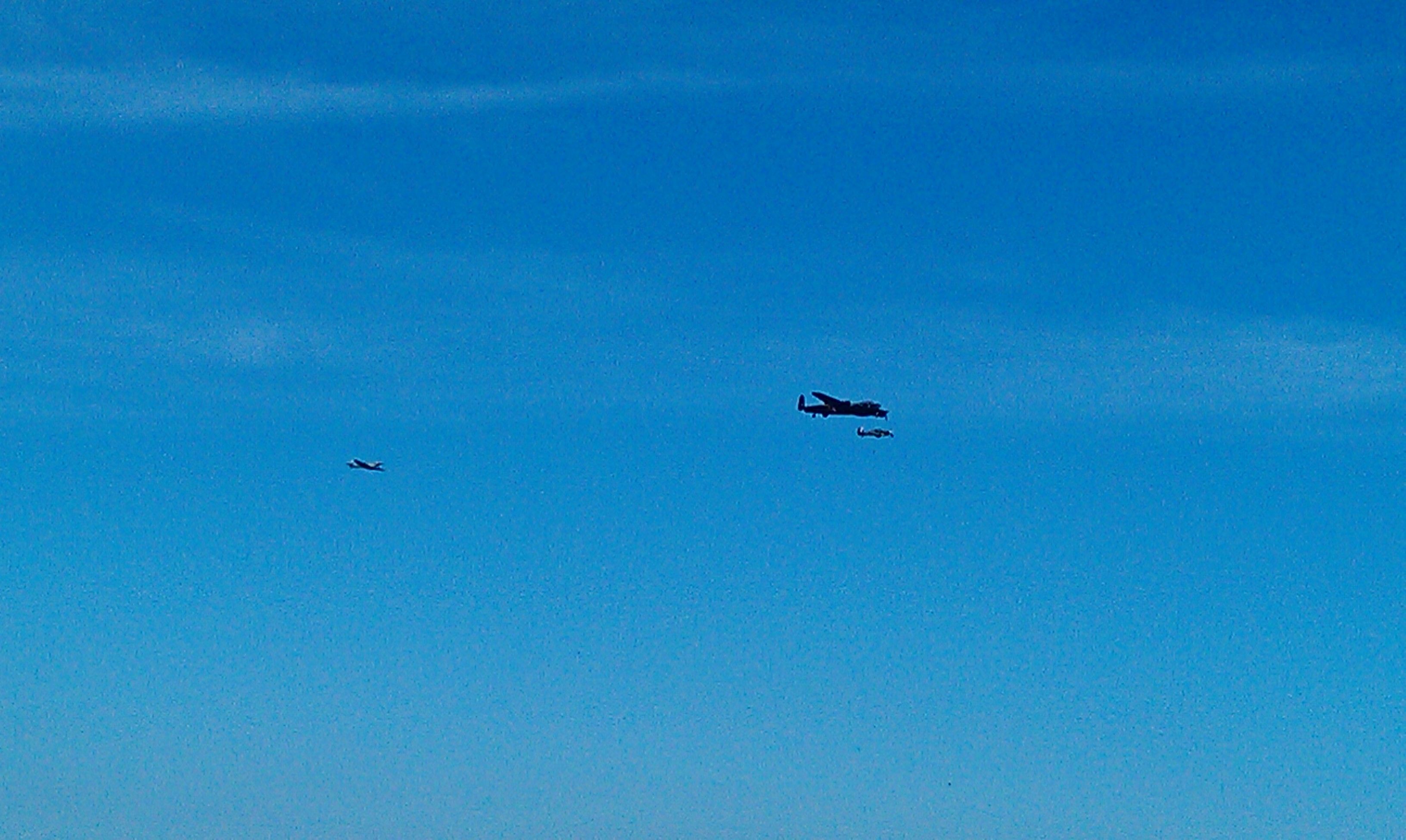 The fighters reform on the bomber for the final flypast