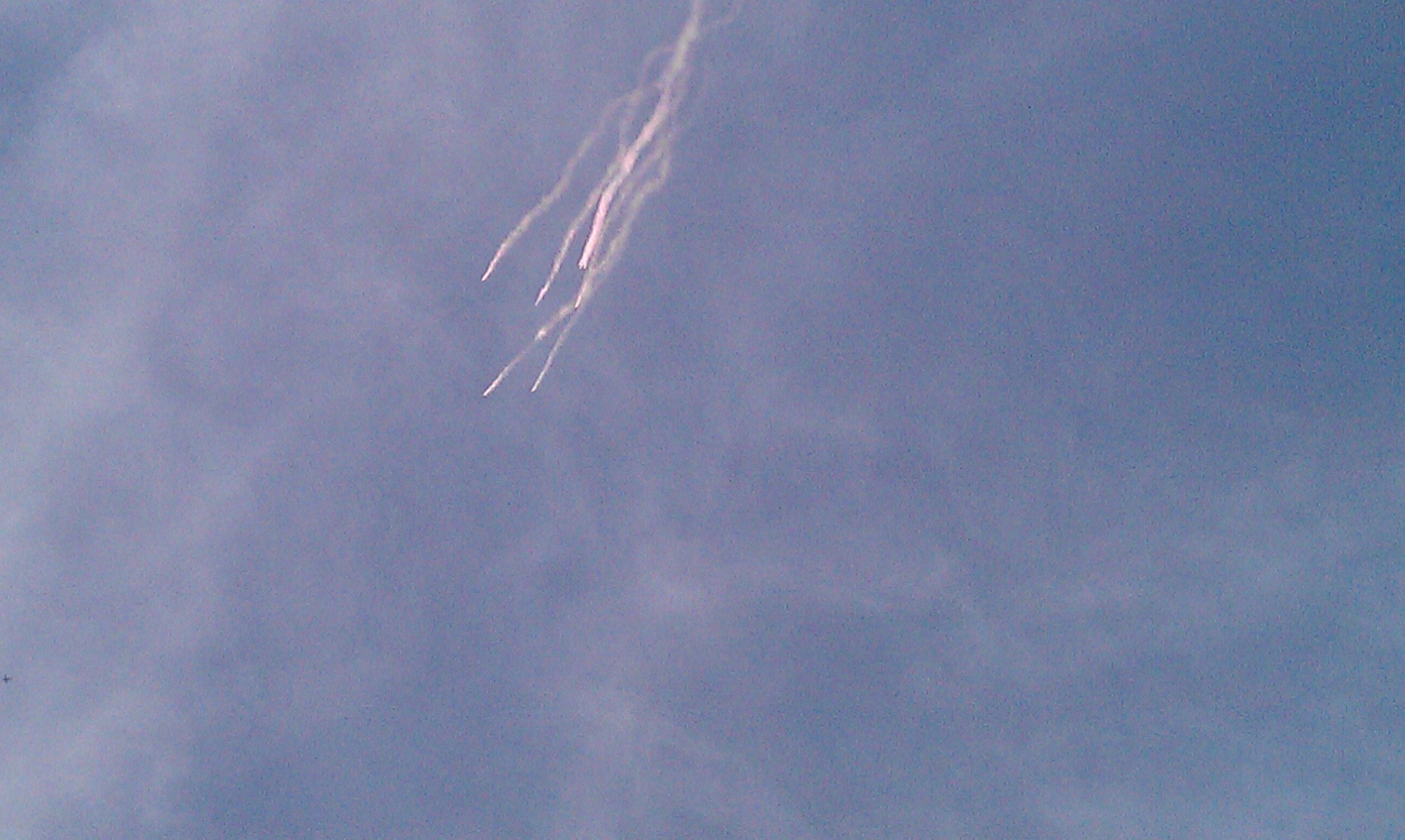 Parachutists light their smoke