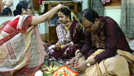 Sourav and Arpita at Sourav's house with Sourav's mother. This ceremony is called Baron which means the acceptance
